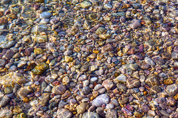 Pebbly beach background from Paphos, Cyprus. Shingle beach