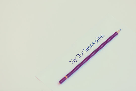 Paper with words Business plan