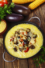 Polenta baked with vegetables and cheese