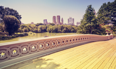 Fototapeta na wymiar Vintage stylized bridge in Central Park, New York, USA