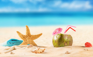 summer coconut cocktail on tropical beach.