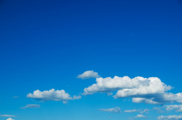 white fluffy clouds in the blue sky