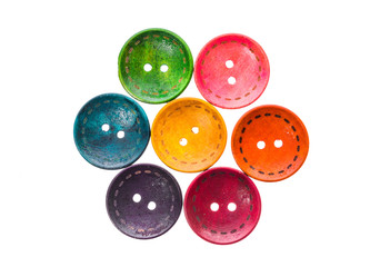 Different color round circular shaped sewing buttons in a flower