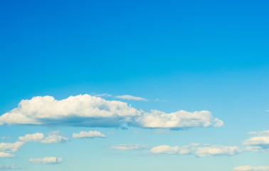 white fluffy clouds in the blue sky