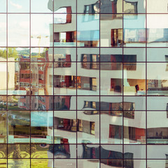Modern architecture building reflected on glass facade