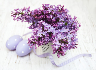 easter eggs and fresh lilac flowers