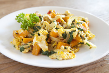 Scrambled eggs with kale and squash