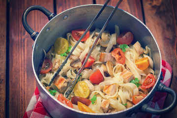 Homemade pasta with mushroom,chicken meat and vegetables