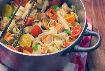 Homemade pasta with mushroom,chicken meat and vegetables