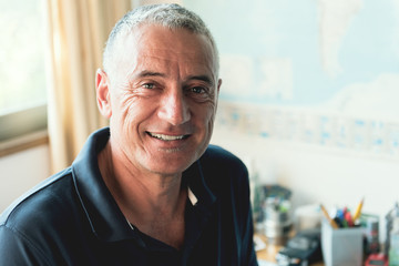 Mature Hispanic Man At Home office