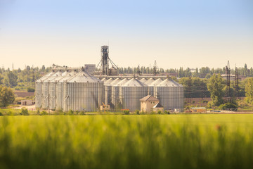 panorama of modern metal silo in countryside