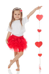 Little girl  with hearts in studio 