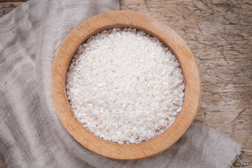 Fototapeta na wymiar Rice in wooden bowl