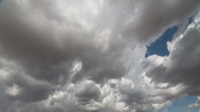 Fantastic Clouds 0307: Time lapse clouds travel across a blue sky.