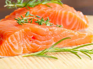Raw salmon on cutting board