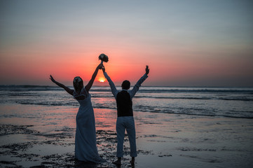 Fototapeta premium the bride and groom at sunset