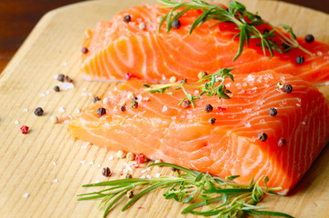 Raw salmon on cutting board