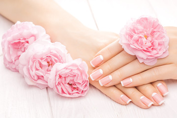 Fototapeta premium french manicure with rose flowers. spa