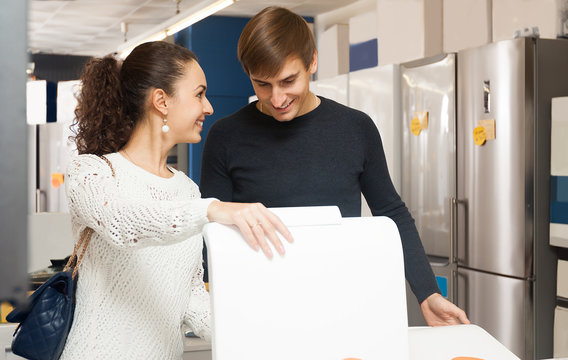 Couple Buying New Clothes Washer