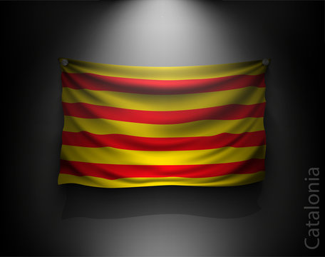 waving flag catalonia on a dark wall 