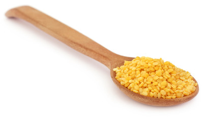 Mung dal in wooden spoon