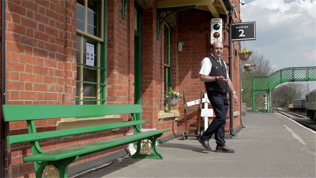 British Railway: train station master checking train times