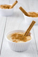 Rice pudding on white wood
