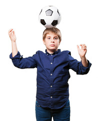 little boy playing soccer