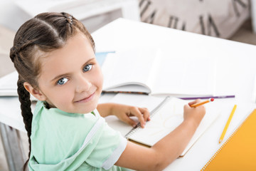 Cute little girl doing homework