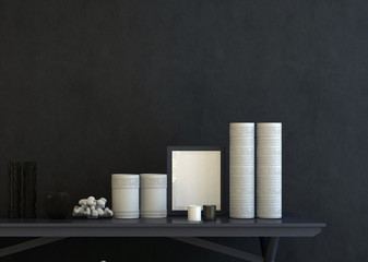 Empty picture frame flanked by modern ceramics