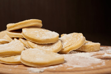 raw homemade cookies on a wooden board