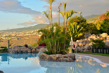 Scene with swimming pool and tropical vegetation.Canary Islands.Spain.
