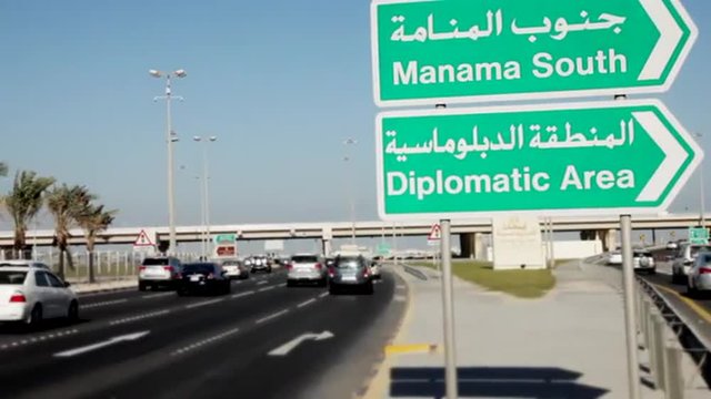 Shaikh Khalifa Bin Salman Highway and Motorway sign in Manama, Bahrain - Camera Pan - Tilt Shift lens