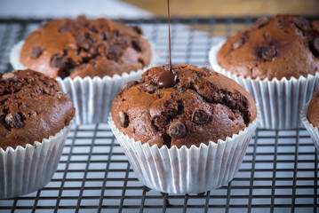 Muffins topped with warm chocolate