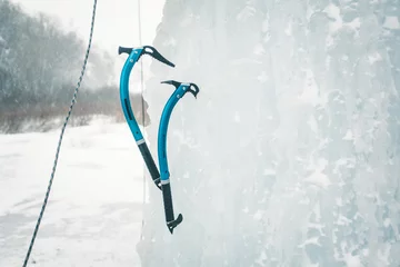 Fotobehang Ice climbing tool. © Nikolay Popov