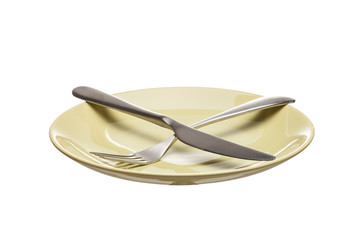 green empty plate with fork and knife isolated on a white background