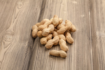 Peanuts on wooden table