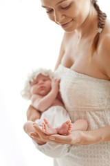 Obraz na płótnie Canvas Happy mother with newborn 