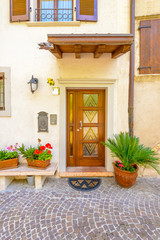 Fototapeta na wymiar Entrance of an old apartment building in Malcesine, Italy.