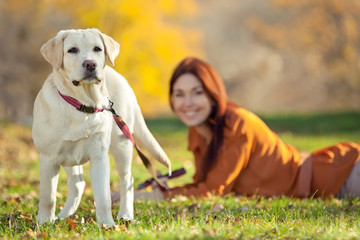 Woman with labrador on the nature