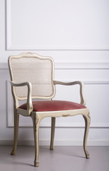 Vintage chair against white wall