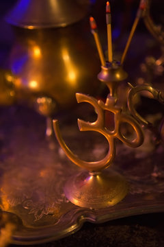 Incense in a Golden stand of Om symbol form and Luxurious gold s