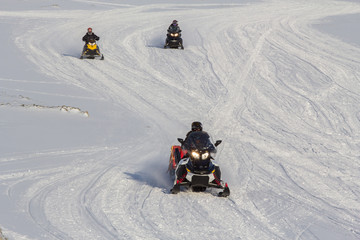 People on a snowmobiles  in Longyearbyen, Spitsbergen (Svalbard)