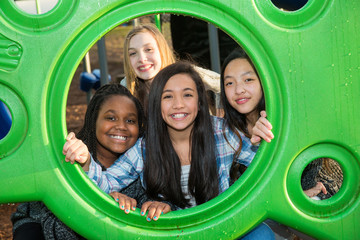 Group of four children with cultural diversity playing together
