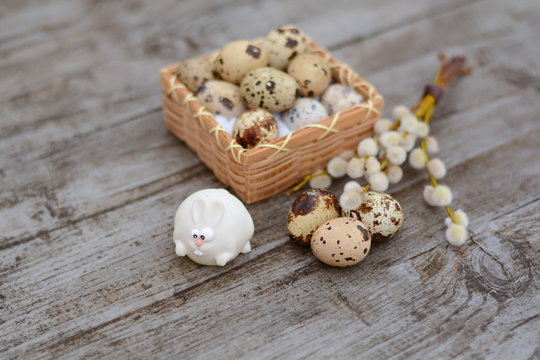 White Easter bunny and guail egg close-up