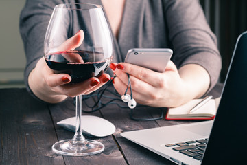 Woman using laptop sitting at table