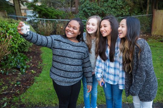 group of kids taking a selfie