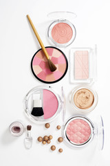 cosmetics on white with light shadows
