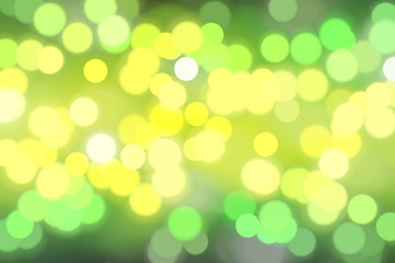 Bokeh light, shimmering blur spot lights on green abstract