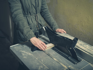 Young person operating tablesaw